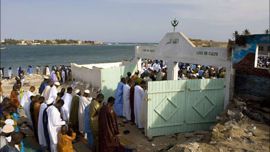 r_Villagers pray at the local mosque during Tabaski celebrations in N'Gor village near Dakar December 21,2007. On Eid al-Adha, also known as Tabaski in West Africa