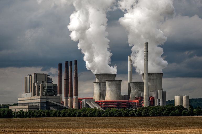 epa10092428 Steam rises from the lignite-fired power plant Neurath operated by German energy supplier RWE near Grevenbroich, Germany, 26 July 2022. The German parliament earlier this month passed a regulation to prolonge operations of coal-fired power plants, while coal power is being phased-out, in order to bridge the gap and compensate for a reduced gas delivery from Russia via pipelines. The Rhenish lignite mining region in western Germany is the largest CO2 emitter in Europe. EPA-EFE/SASCHA STEINBACH