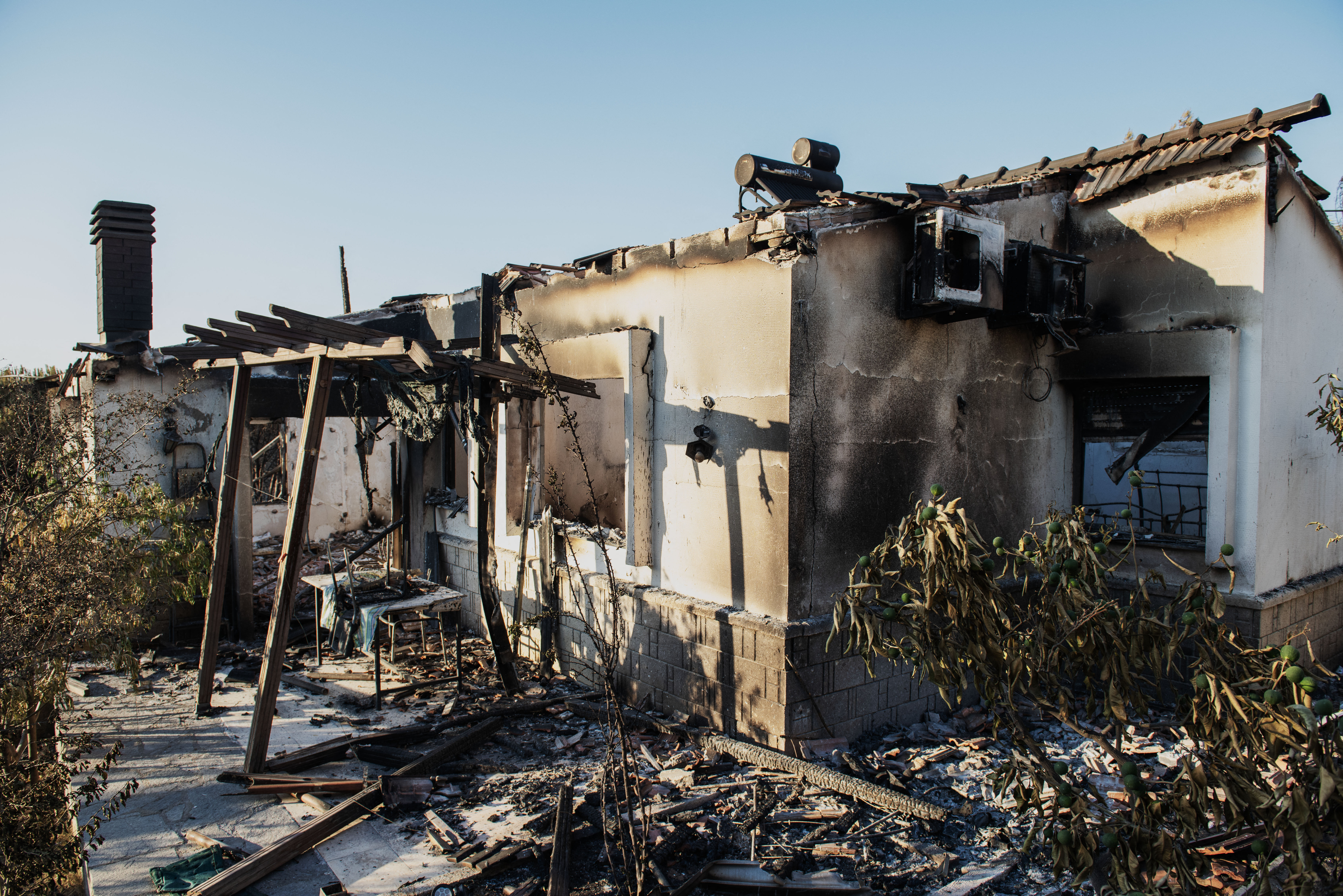 A burned house stands among debris following a wildfire in the Seferihisar district of Izmir, Turkey, on June 30, 2025