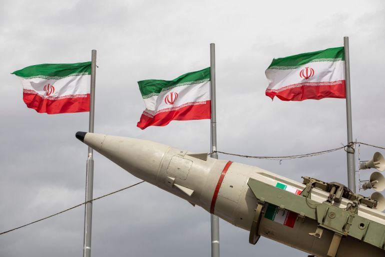 TEHRAN, IRAN - FEBRUARY 11: Missiles produced by Iran's armed forces are displayed near a row of Iranian flags during commemorations to mark the anniversary of the 1979 Iranian Revolution on February 11, 2026 in Tehran, Iran. In that year, Ruhollah Khomeini led an overthrow of the Pahlavi dynasty in 1979 and established himself as Supreme Leader of the Islamic Republic of Iran. (Photo by Majid Saeedi/Getty Images)