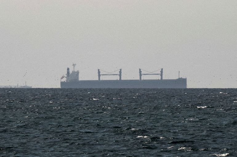 FILE PHOTO: FILE PHOTO: A cargo ship in the Gulf, near the Strait of Hormuz, as seen from northern Ras al-Khaimah, near the border with Oman’s Musandam governance, amid the U.S.-Israeli conflict with Iran, in United Arab Emirates, March 11, 2026. REUTERS/Stringer/File Photo/File Photo/File Photo