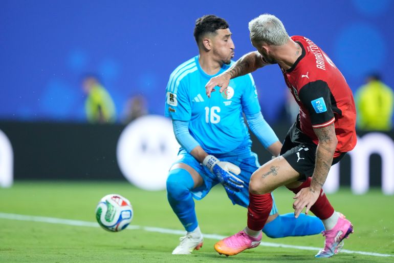 Austria's Marko Arnautovic (7) scores the team's first goal past Algeria goalkeeper Oussama Benbot (16) during the World Cup Group J soccer match between Algeria and Austria in Kansas City, Mo., Saturday, June 27, 2026. (AP Photo/Charlie Riedel)